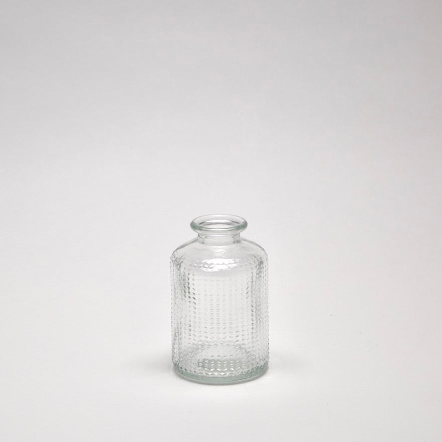 Clear glass bottle with textured design for modern interior styling