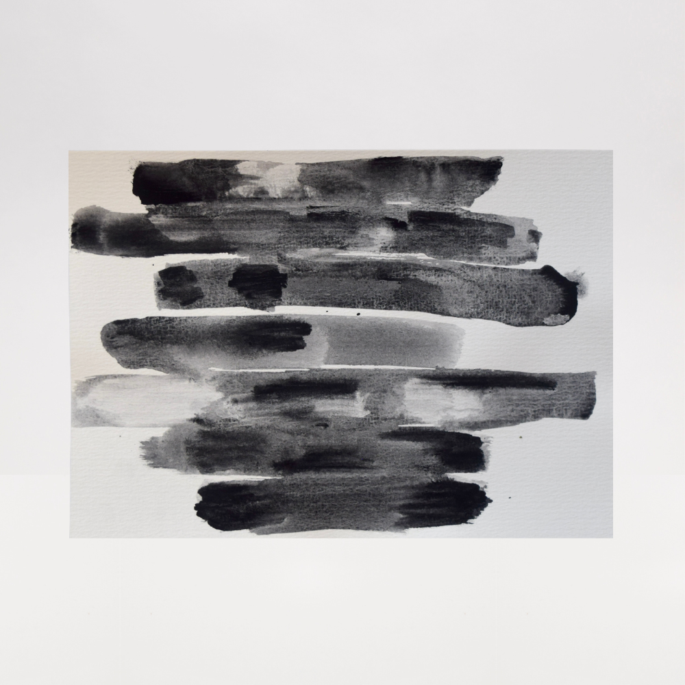 Abstract art piece with black brush strokes on a white background