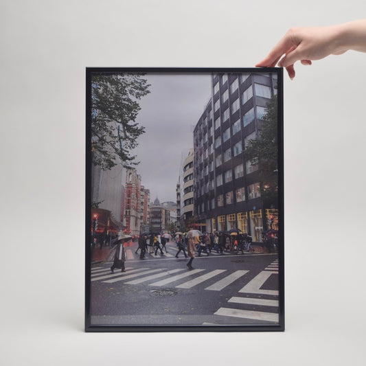 Framed cityscape print with people crossing a street for modern home styling