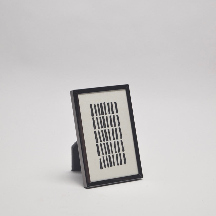 Framed artwork with geometric design for a minimal chic home