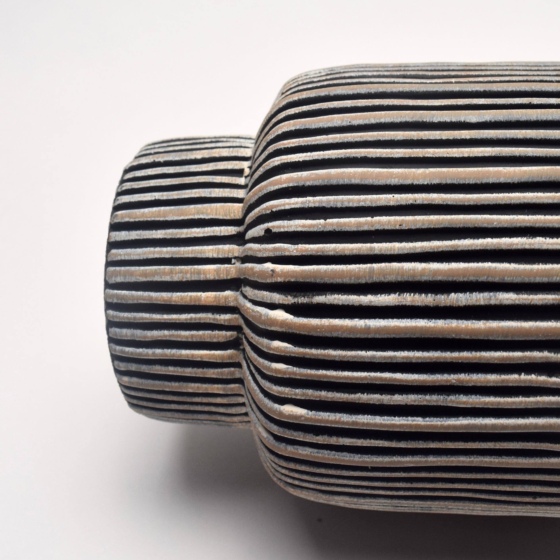 Pedestal shape bottom of striped textured plant pot