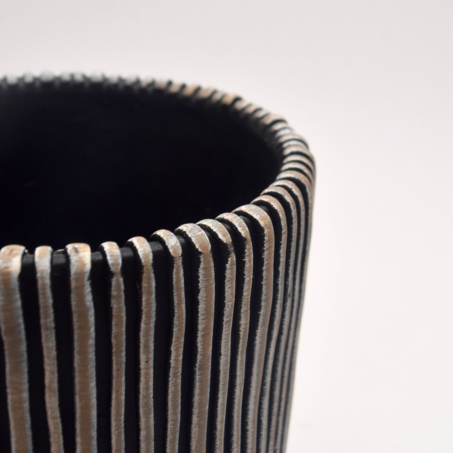 Black and white striped plant pot close-up detail 