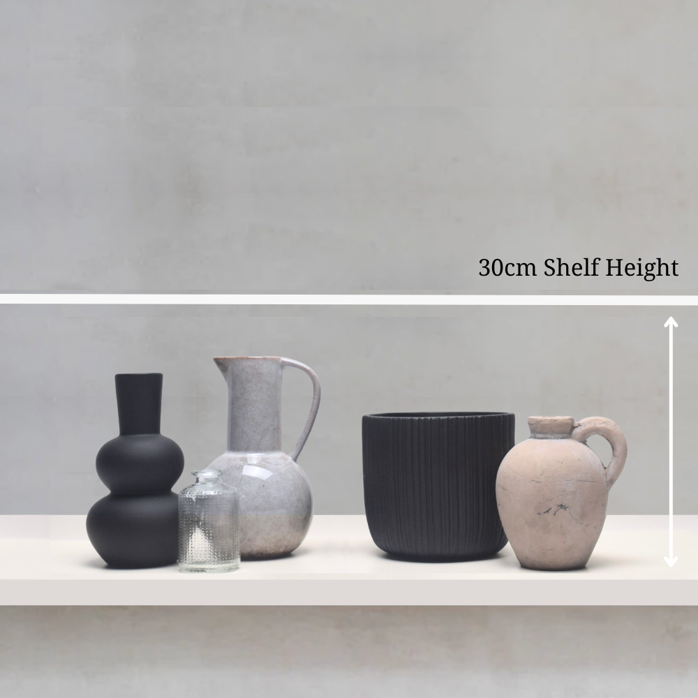 Set of ceramic vases on a shelf with a measurement label indicating 30cm shelf height.
