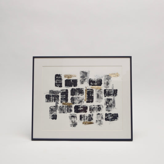 Framed abstract artwork with black and gold metallic pattern for unique home interior styling