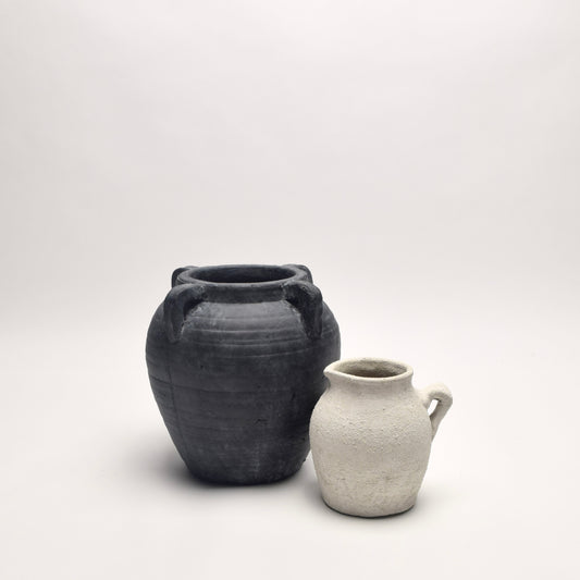 Charcoal terracotta 4 handle amphora-like vase with smaller off-white ceramic textured jug. 