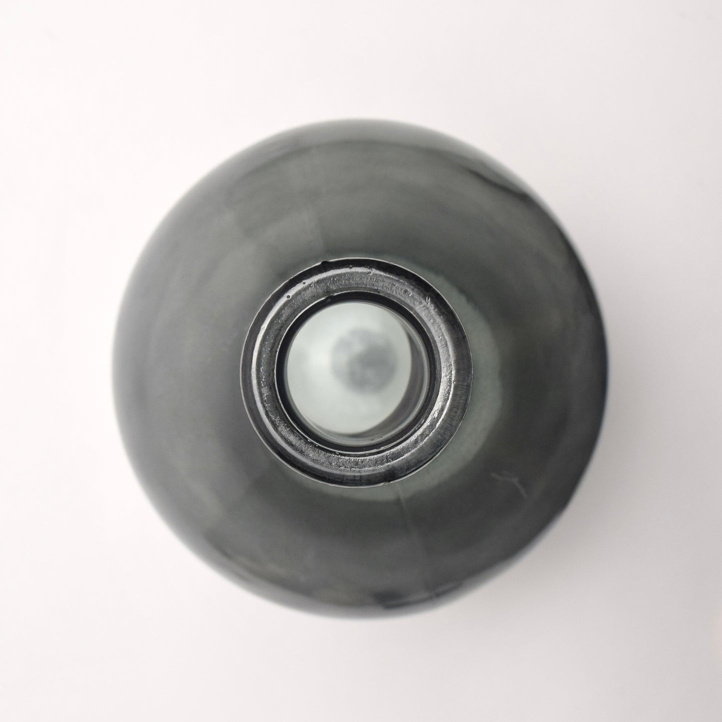 Top View of charcoal dark glass bottle vase