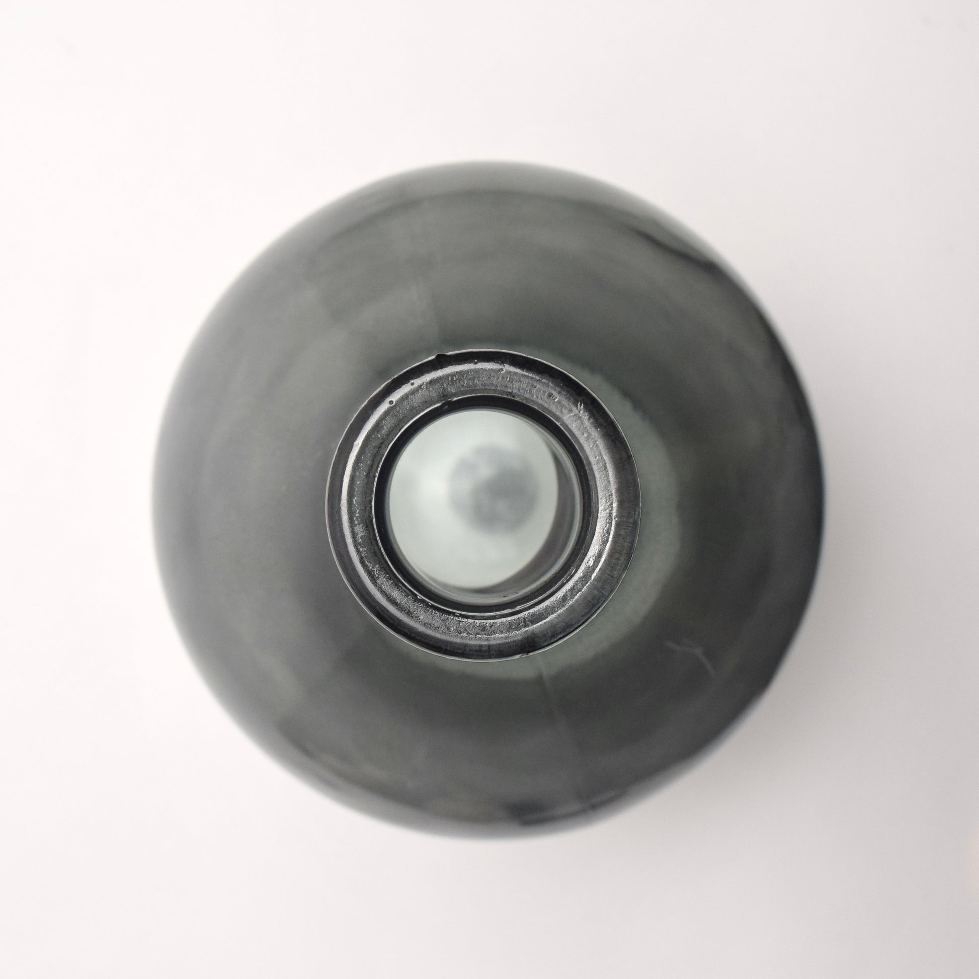 Top View of charcoal dark glass bottle vase
