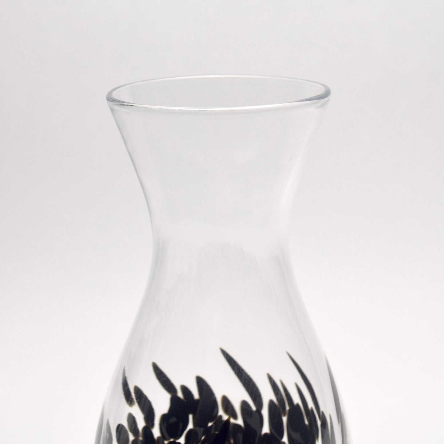 Top Neck of a vase made from clear glass and decorated with a black pattern