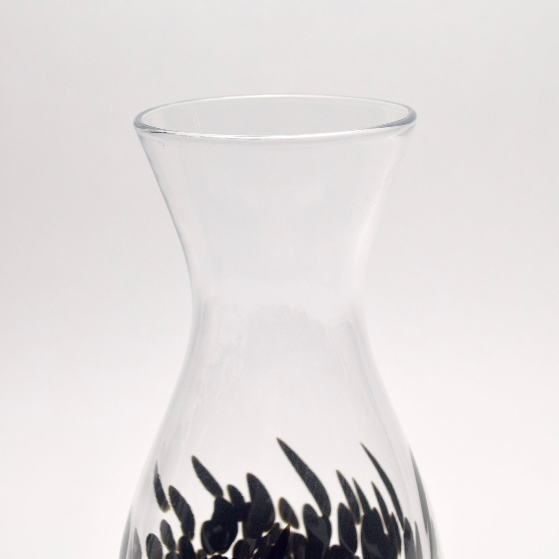 Top Neck of a vase made from clear glass and decorated with a black pattern