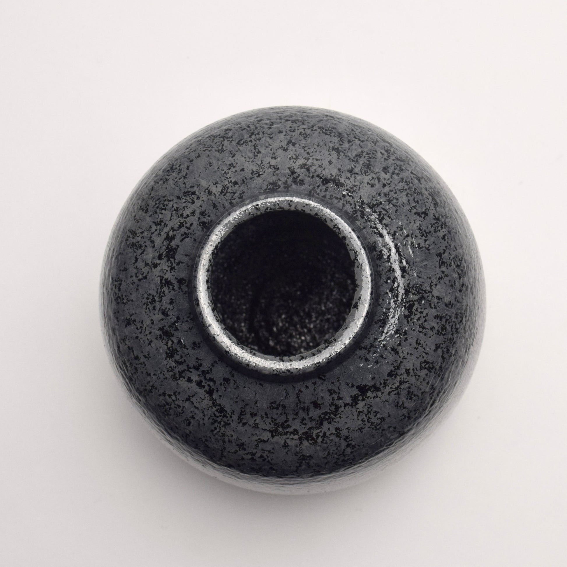 Top circular view of dark grey speckled ceramic vase