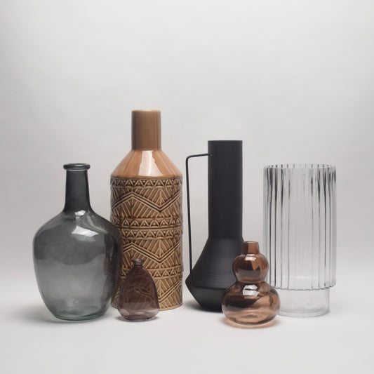 Collection of various tall vases with different patterns for side table styling