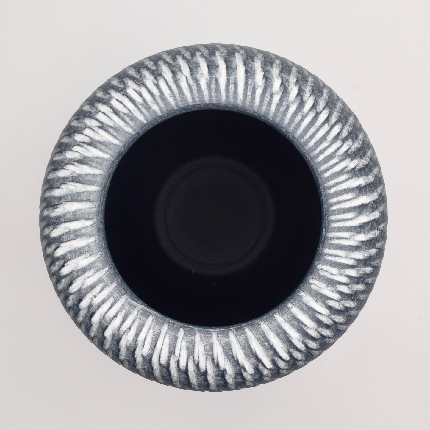 Decorative grey terracotta vase with textured pattern