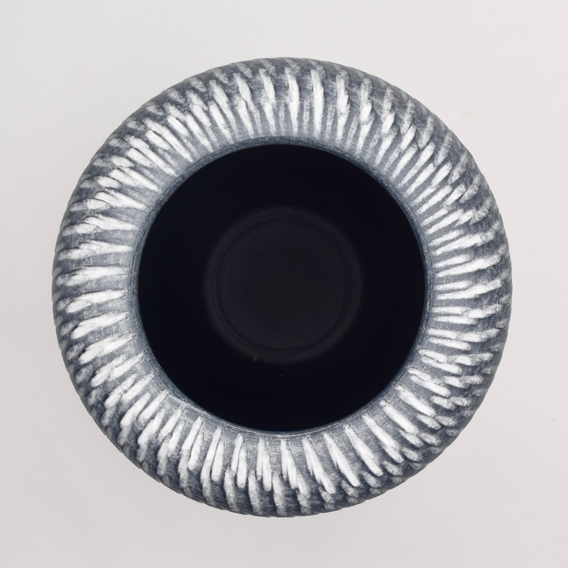 Decorative grey terracotta vase with textured pattern