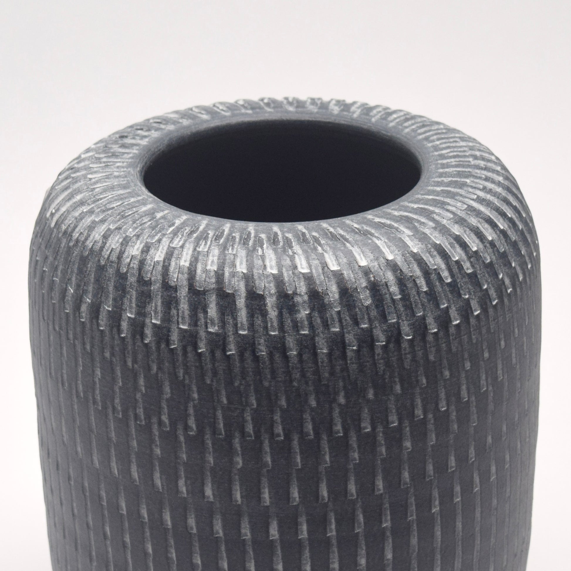 Grey linear patterned cylindrical pillar shaped vase 