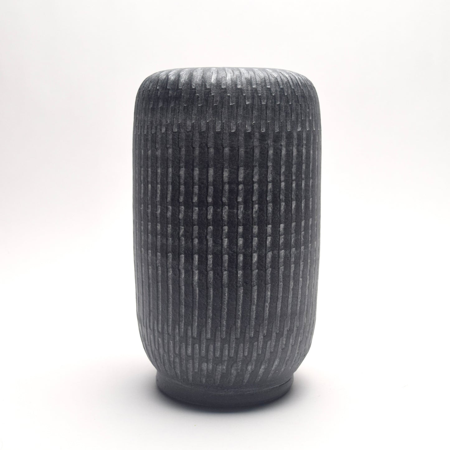 Textured grey terracotta vase with strong pillar, column shape