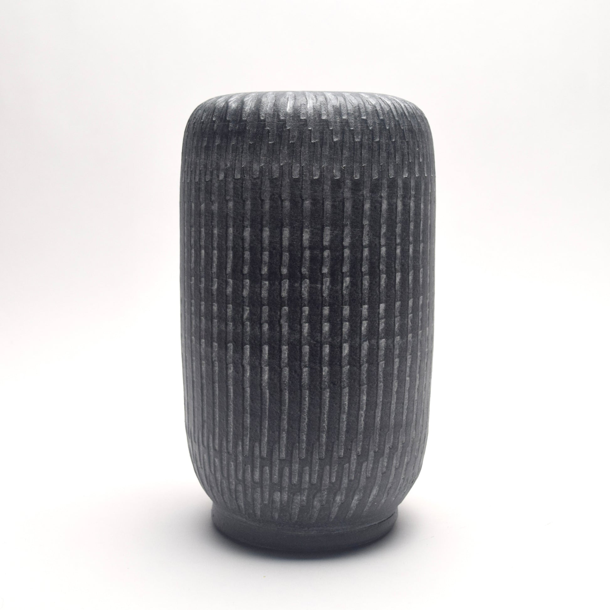 Textured grey terracotta vase with strong pillar, column shape