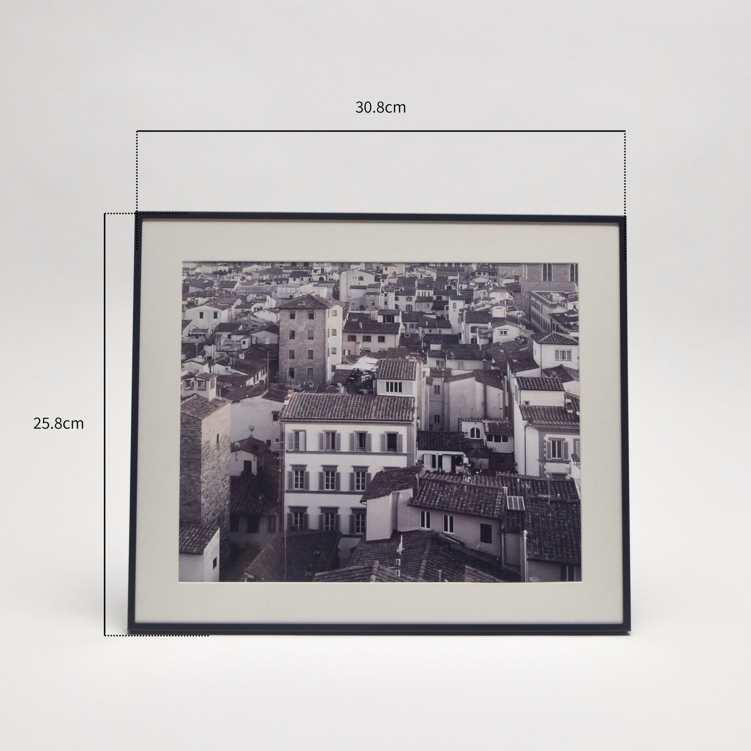 Framed black and white photo of a cityscape with dimensions indicated