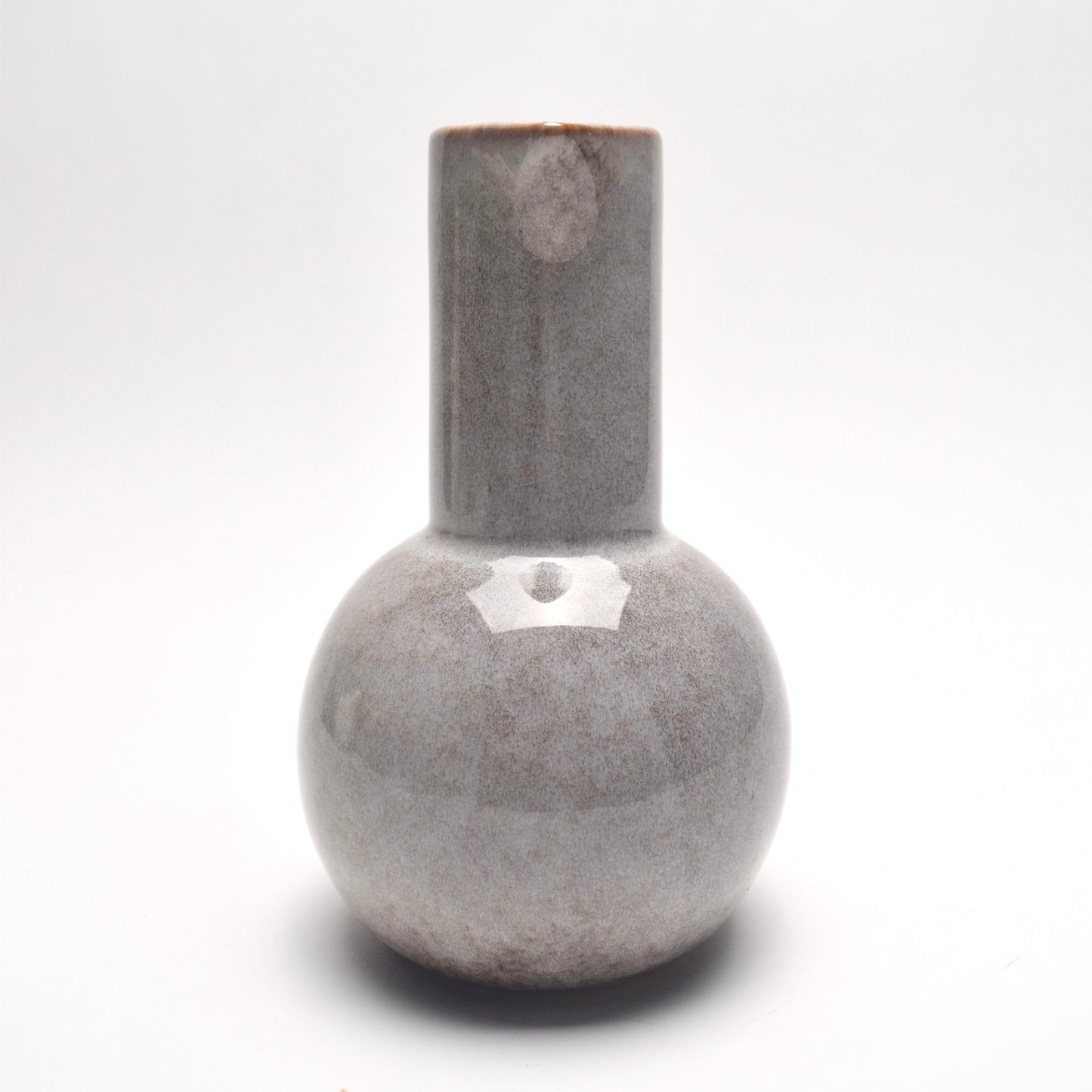 Light grey ceramic glazed jug with brown speckles, view from straight on