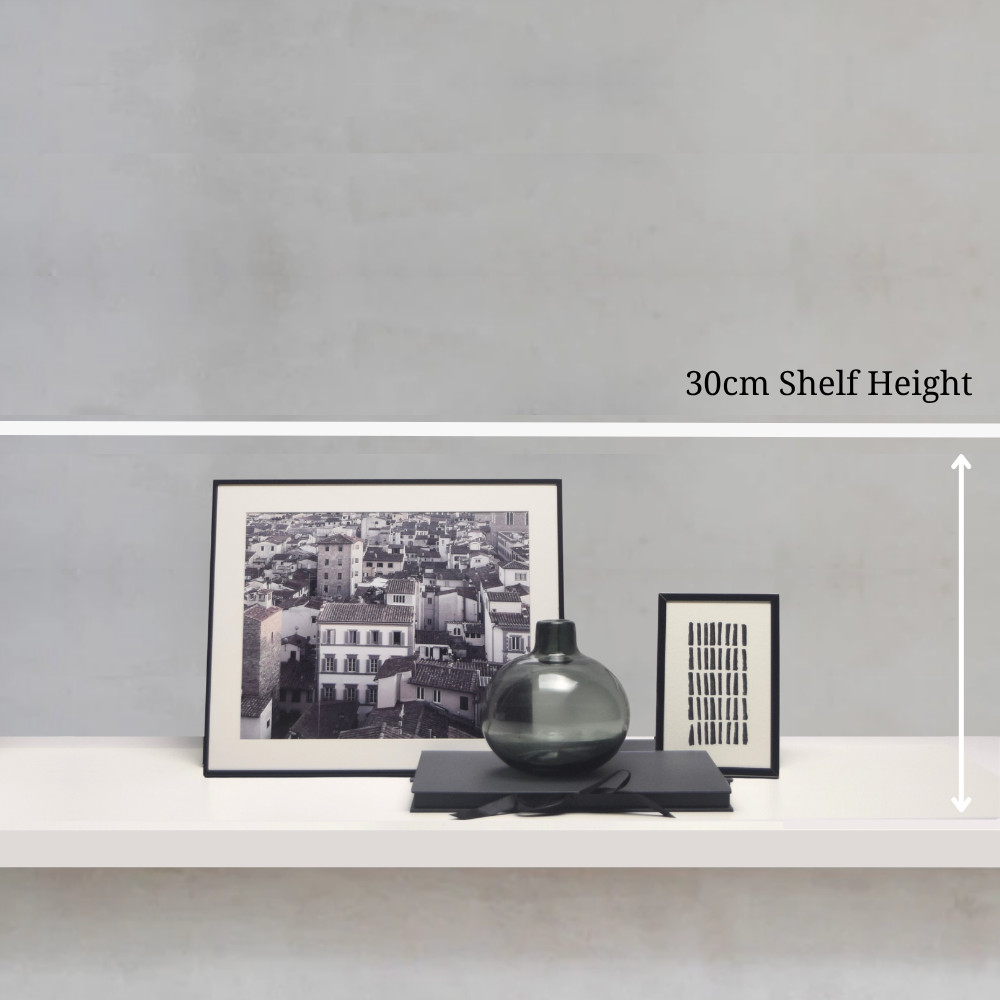 Shelf with decorative items including framed artwork and vases against a grey wall, showing a 30cm shelf height measurement.