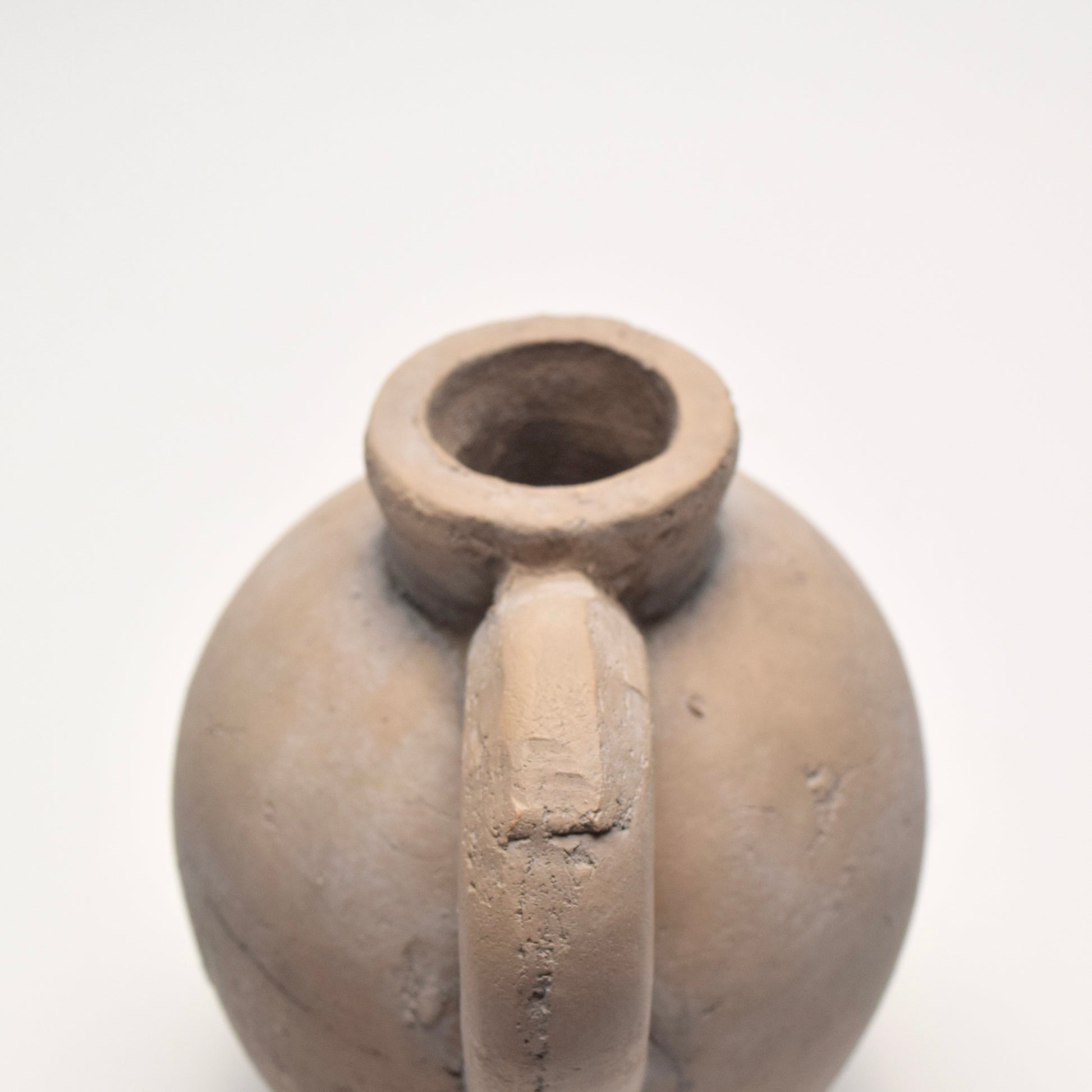 Rustic decorative clay jug with handle