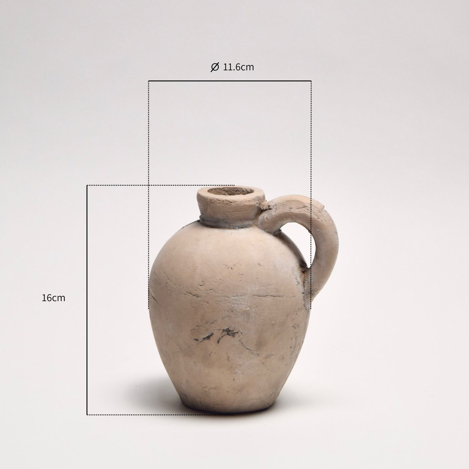 Ceramic decorative jug with a handle with dimensions annotated