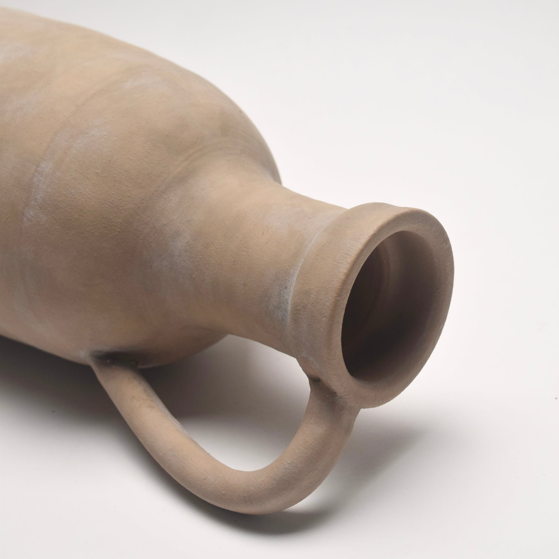 Beige ceramic decorative vase with sleek handle