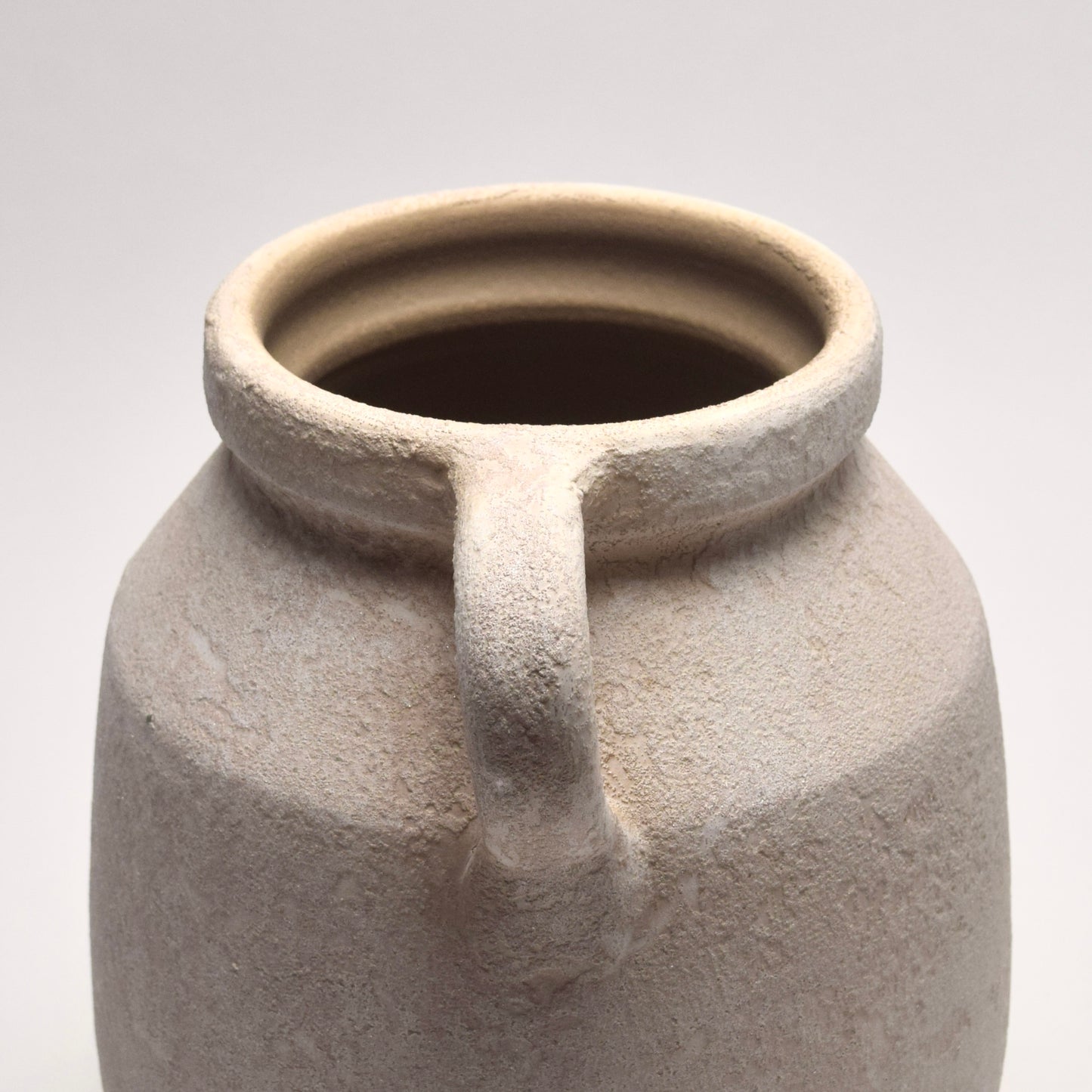 Off-White ceramic vase with a handle  view from the side