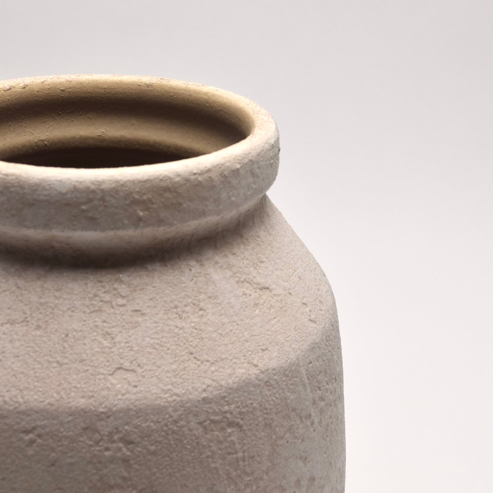 White ceramic vase with sand-like texture
