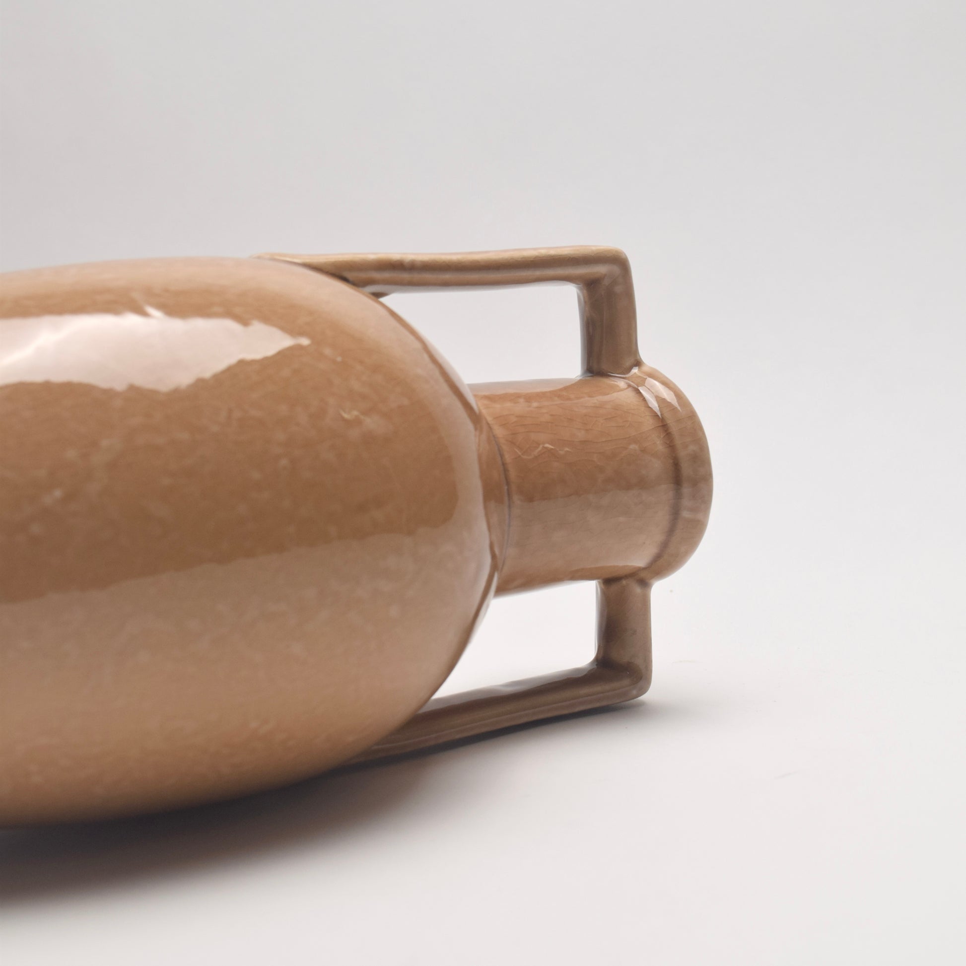 Brown ceramic bottle vase with handle 
