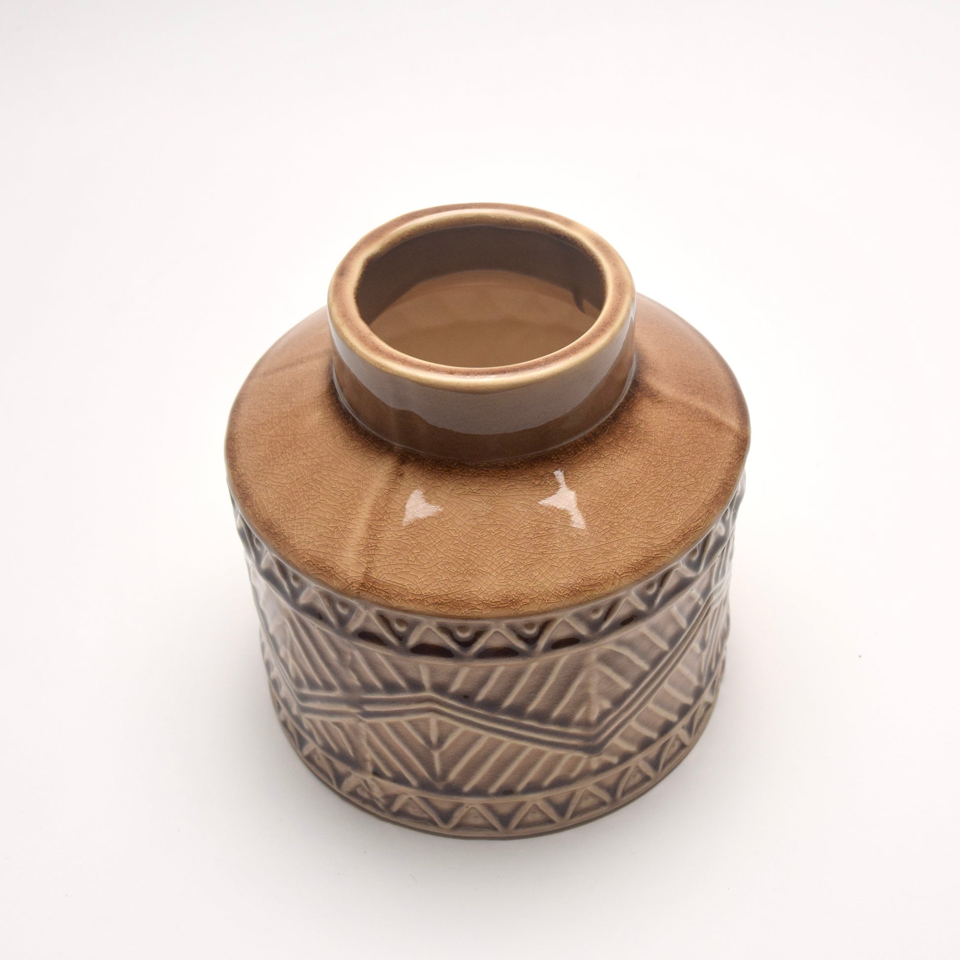 Decorative ceramic vase with geometric pattern on a white background