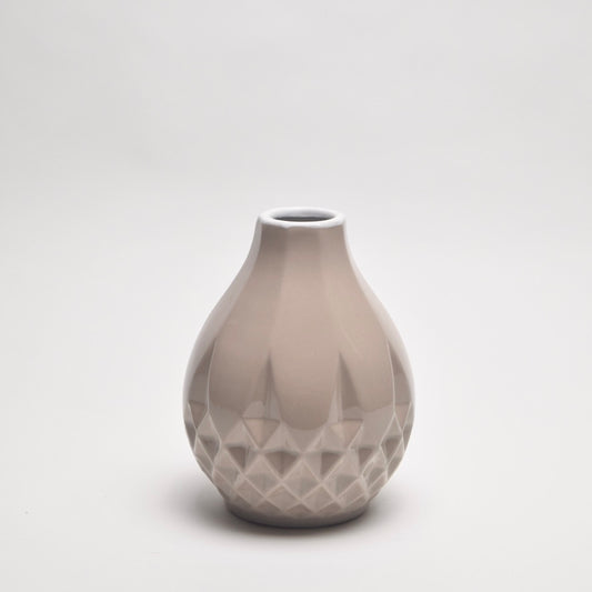 Taupe ceramic jug with a geometric pattern for shelf styling