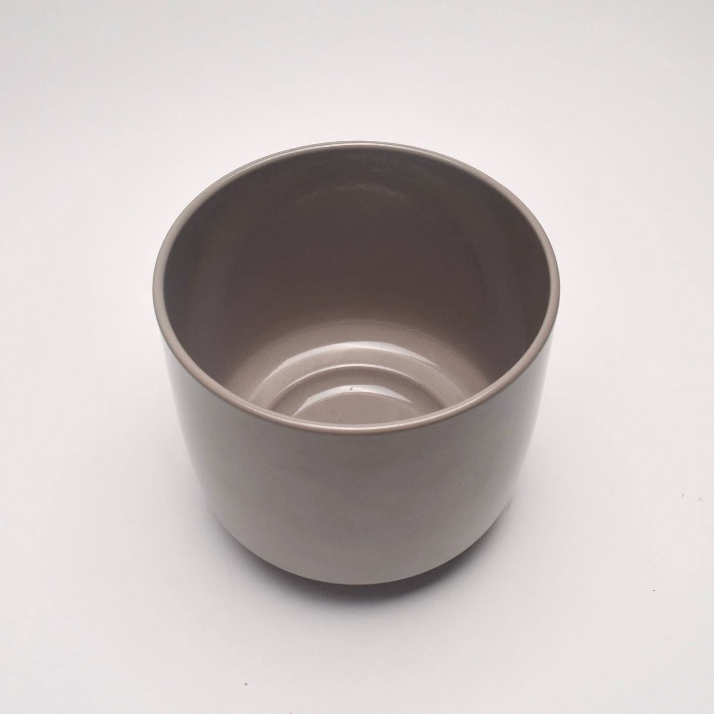 View from above taupe glazed plant pot with smooth sleek surface