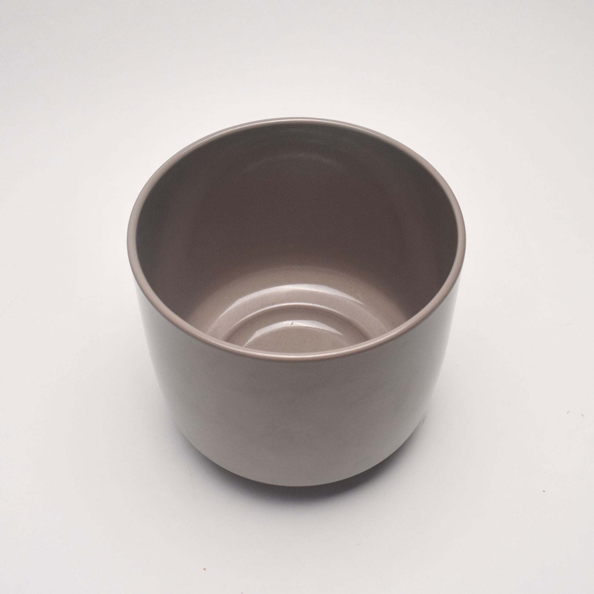 View from above taupe glazed plant pot with smooth sleek surface