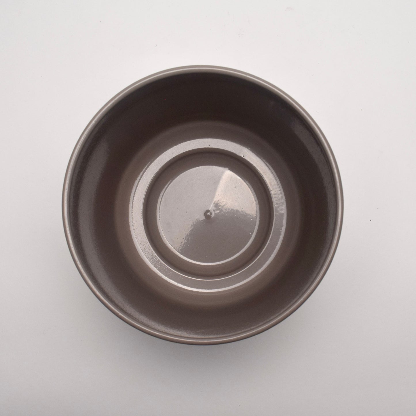 Taupe glazed plant pot view from above, shiny smooth surface