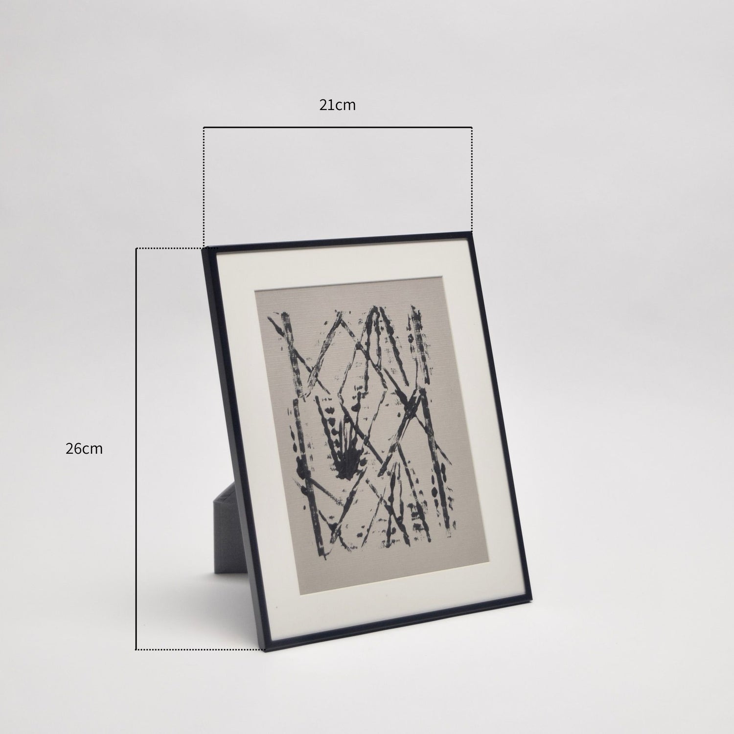 Framed taupe and black abstract artwork with dimensions indicated on a light background