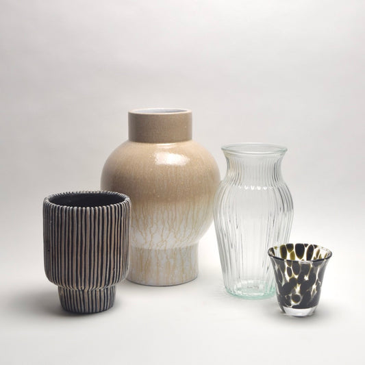 Four different types of vases in a set for neutral home interior styling