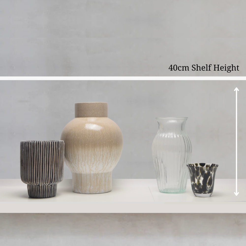 Four vases of different designs on a shelf with a grey wall background, showing a 40cm shelf height.